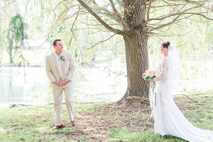 First Look Bride Groom Outdoors Tree Lake Lace Gown Cream Suit Bright Coral Garden Wedding New Jersey http://somethingbluenj.com/