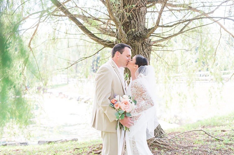 Bride Lace Gown Groom Cream Suit Pastel Bouquet Kiss Bright Coral Garden Wedding New Jersey http://somethingbluenj.com/