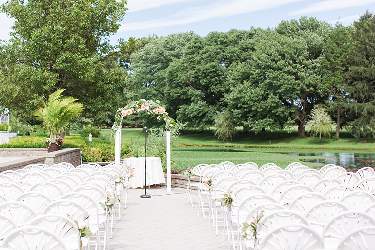 Venue Outdoors Archway White Chairs Lake Bright Coral Garden Wedding New Jersey http://somethingbluenj.com/