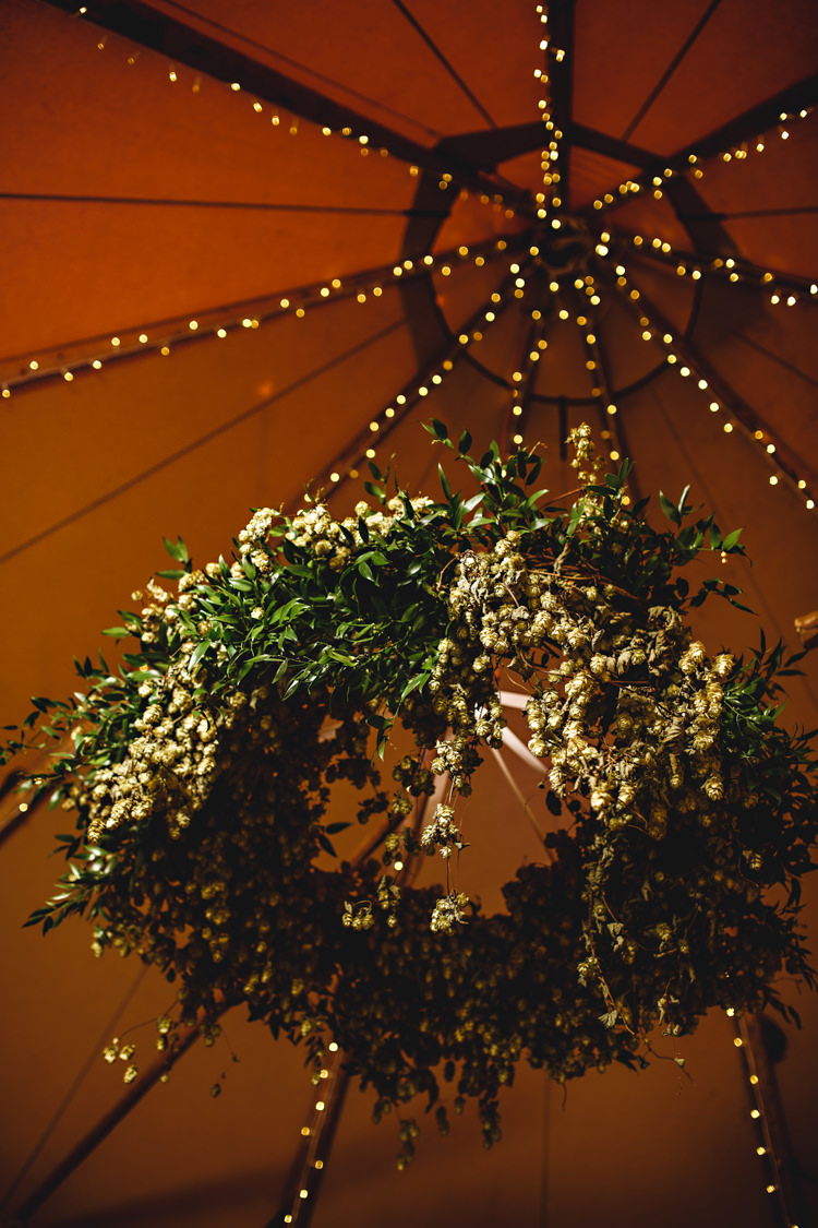 Hanging Hops Flowers Ceiling Fairy Lights Hoop Cosy Autumn Woodland Tipi Wedding Ideas http://hbaphotography.com/