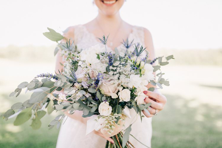 Bride Updo Lace Dress Floaty Bouquet Blush Roses Purple Thistle Outdoorsy Modern Wedding in Wisconsin http://www.mcnielphotography.com/