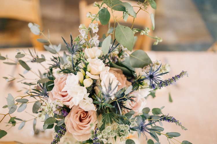 Centre Piece Table Decor Roses Greenery Thistle Purples Blush Pink Cream Outdoorsy Modern Wedding in Wisconsin http://www.mcnielphotography.com/