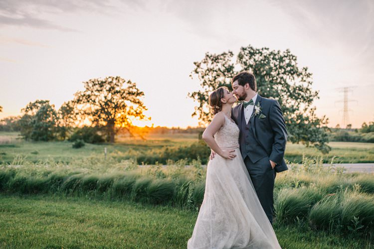 Bride Groom Bow Tie Floaty Dress Gown Blush Lace Scoop Back Buttons Sunset Updo Outdoorsy Modern Wedding in Wisconsin http://www.mcnielphotography.com/