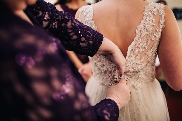Bride Getting Ready Dress Lace Buttons Outdoorsy Modern Wedding in Wisconsin http://www.mcnielphotography.com/