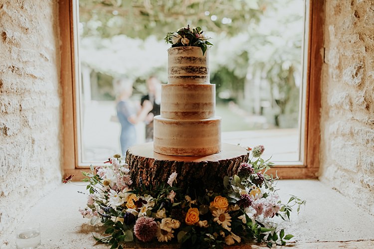 Semi Naked Cake Flowers Log Stand Beautiful Simple Relaxed Barn Wedding http://jenmarino.com/