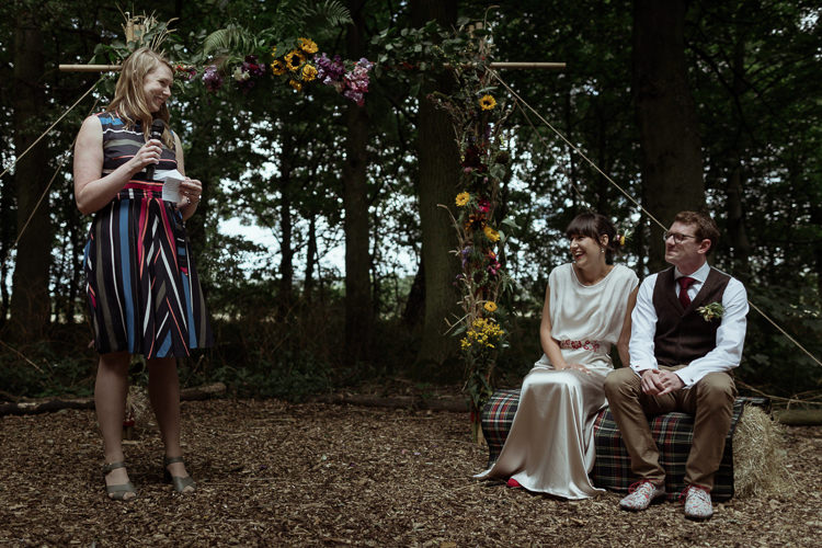 Bamboo Ceremony Structure Flowers Floral Reading Hay Bale Magical Woodland Clearing Colourful Tipis Wedding https://www.lukebellphotography.co.uk/