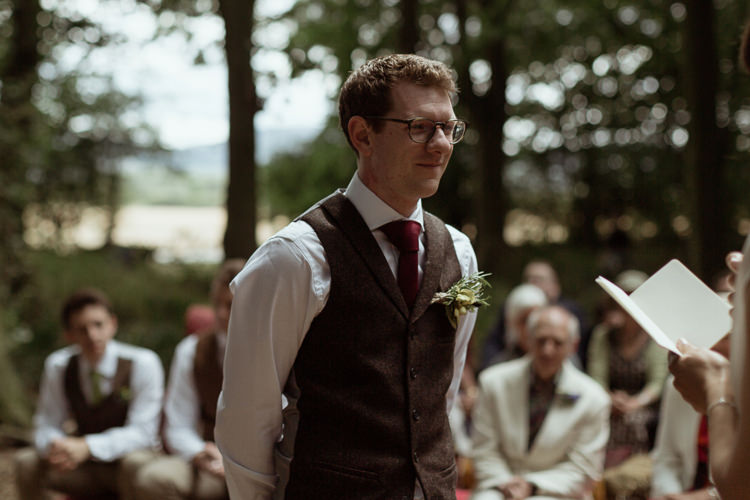 Groom Tweed Waistcoat Red Tie Magical Woodland Clearing Colourful Tipis Wedding https://www.lukebellphotography.co.uk/
