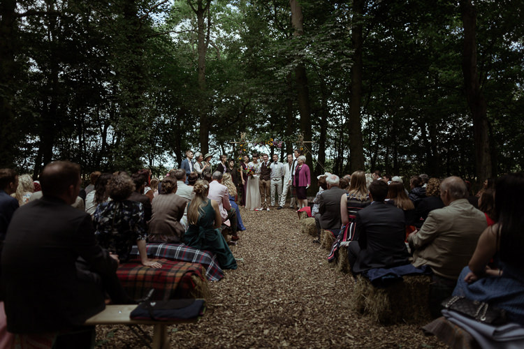 Ceremony Hay Bales Tartan Blankets Rugs Magical Woodland Clearing Colourful Tipis Wedding https://www.lukebellphotography.co.uk/