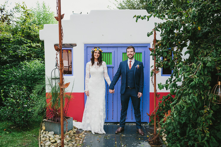 Bride Bridal Rue de Seine Dress Gown Lace Sweetheart Overlay Flower Crown Multicolour Wildflower Bouquet Sunflower Navy Three Piece Waistcoat Groom Orange Tie Small Colourful Cool Alternative Wedding https://www.alexapoppeweddingphotography.com/