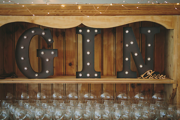 Gin Bar Balloon Glasses Circus Lights Dresser Light Up Letters Pretty Country Gin Wedding http://www.victoriasomersethowphotography.co.uk/