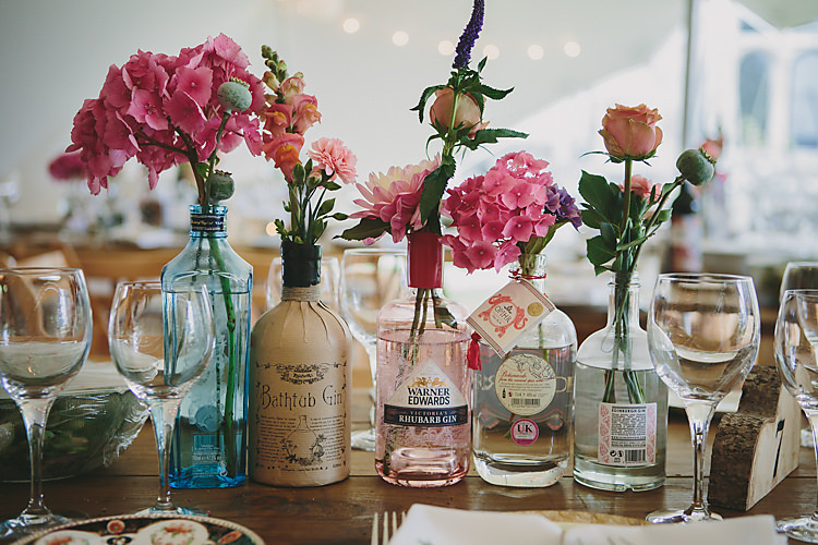 Bottle Bloom Floral Flowers Vintage Pretty Country Gin Wedding http://www.victoriasomersethowphotography.co.uk/