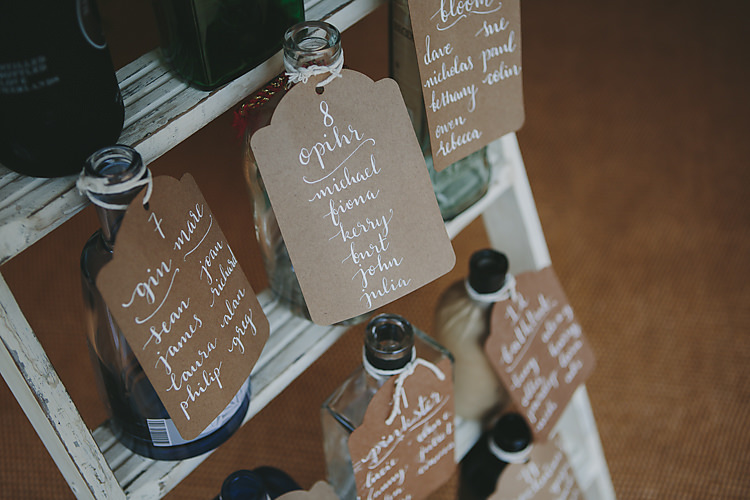Table Plan Bottles Vintage Luggage Tag Modern Calligraphy Pretty Country Gin Wedding http://www.victoriasomersethowphotography.co.uk/