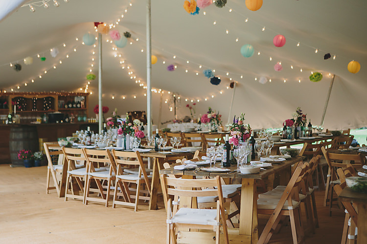 Rustic Wooden Table Chairs Stretch Tent Fairy Lights Pom Pom Lantern Paper Pretty Country Gin Wedding http://www.victoriasomersethowphotography.co.uk/