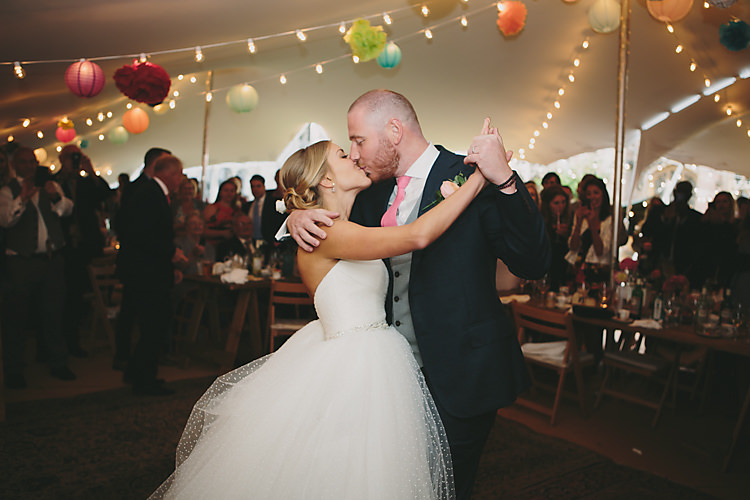 Confetti Bride Bridal Pronovias Gown Dress Sweetheart Neckline Princess Polka Dot Jacket Veil Suitsupply Groom Three Piece Waistcoat Navy Suit Grey Pink Tie First Dance Festoon Fairy Light Paper Lantern Pom Pom Stretch Tent Pretty Country Gin Wedding http://www.victoriasomersethowphotography.co.uk/