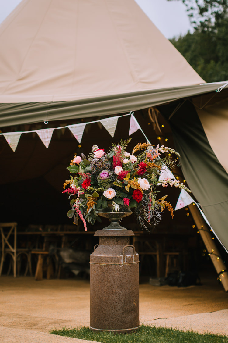 Flowers Arrangememnt Milk Church Urn Outdoor Orange Red Rose Astilbe Greenery Foliage Edgy Seasonal Autumnal Tipi Wedding Ideas http://www.sambennettphotography.co.uk/