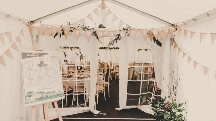 Marquee Entrance Table Plan Seating Chart Festival Bunting Foliage Rose Gold Sequins Greenery Musical Wedding https://www.jademaguirephotography.uk/