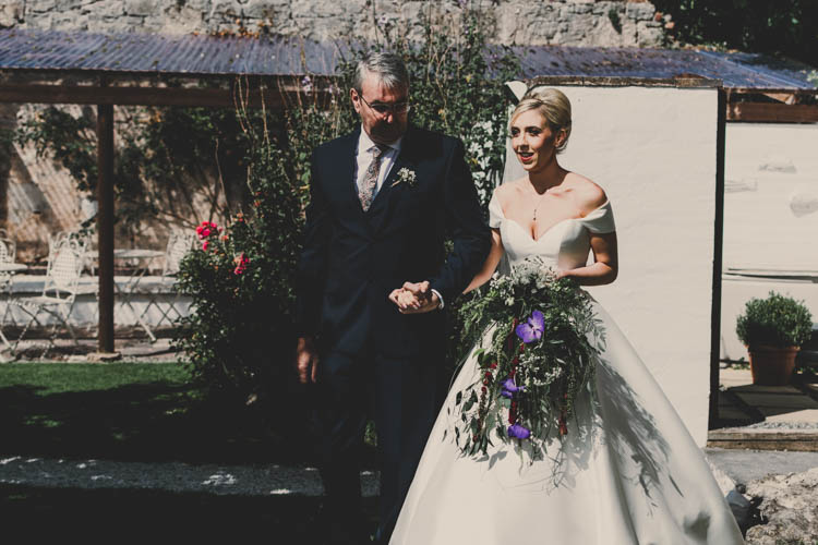 Bride Bridal Princess A Line Bardot Off the Shoulder Straps Trailing Bouquet Foliage Purple Flowers Rose Gold Sequins Greenery Musical Wedding https://www.jademaguirephotography.uk/