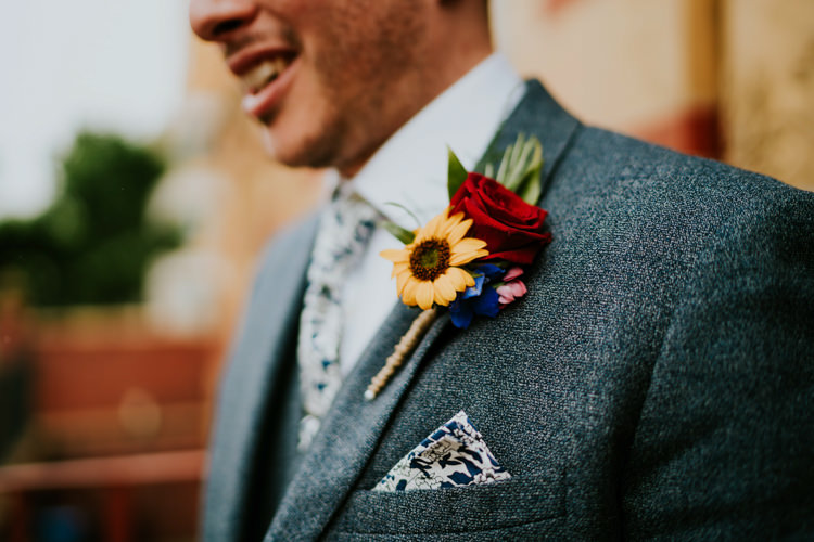 Buttonhole Groom Red Rose Yellow Sunflower Colourful Cool Humanist Pool Wedding http://www.stevebridgwoodphotography.co.uk/