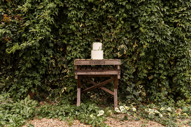 Wooden Cake Table Organic Rustic Greenery Wedding Ideas http://sarahbrookesphotography.com/