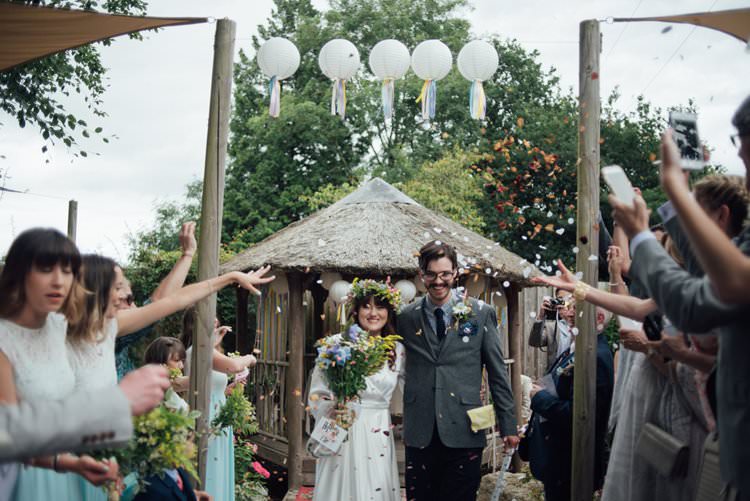 Bride Bridal Flower Crown Wildflower Bouquet Meadow long Sleeve Silk Dress 70s Grey Tweed Groom Mismatched Separates Confetti Shot Moment Adventurous Festival Bohemian Wedding https://libertypearlphotography.com/