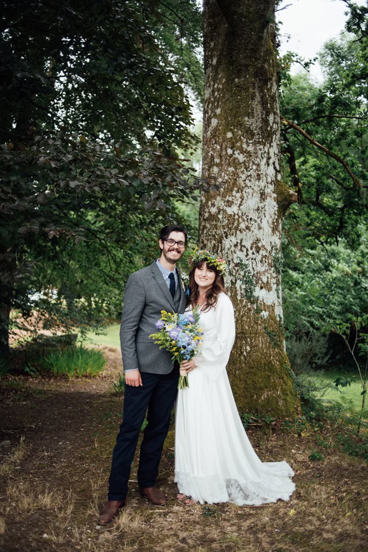 Bride Bridal Flower Crown Wildflower Bouquet Meadow long Sleeve Silk Dress 70s Grey Tweed Suit Navy Trousers Gingham Shirt Blue Adventurous Festival Bohemian Wedding https://libertypearlphotography.com/