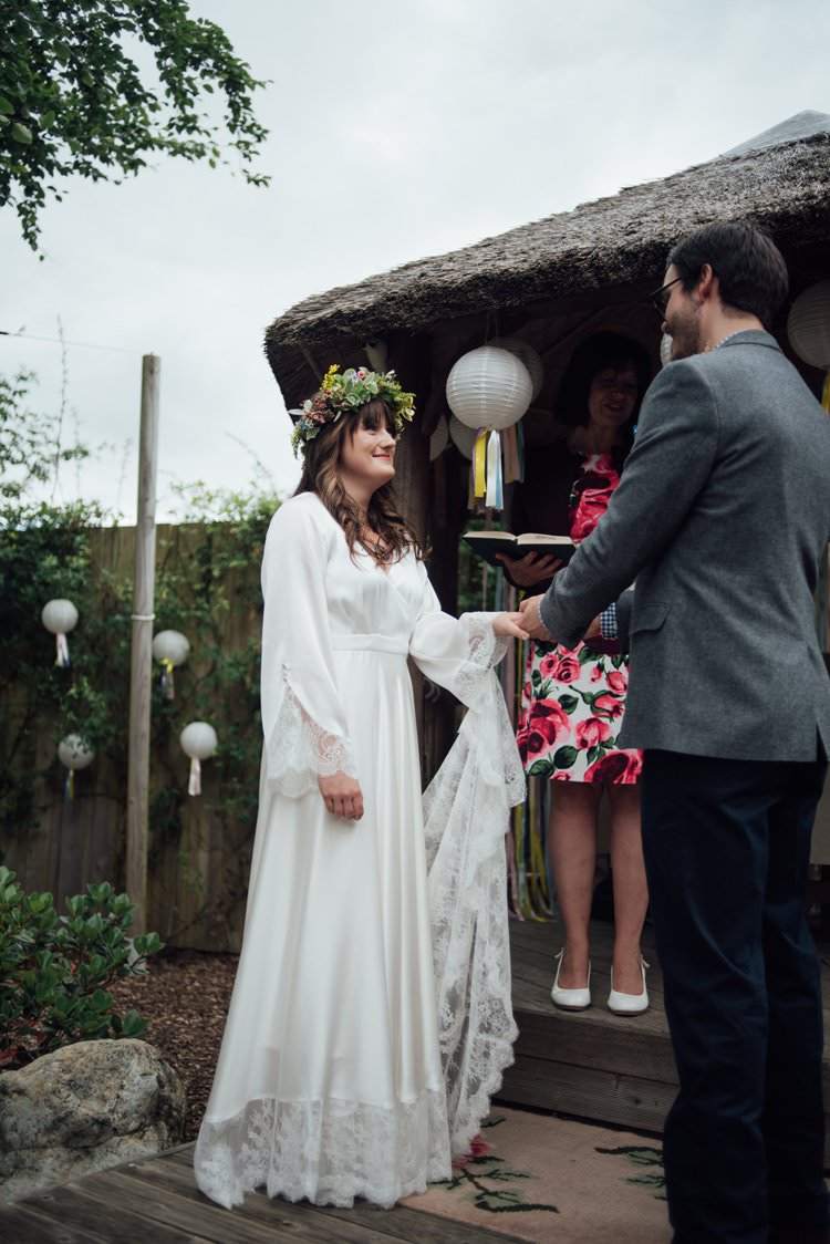 Bride Bridal Flower Crown Wildflower Bouquet Meadow long Sleeve Silk Dress 70s Grey Tweed Groom Mismatched Lanterns Ribbon Tassels Outdoor Ceremony Adventurous Festival Bohemian Wedding https://libertypearlphotography.com/