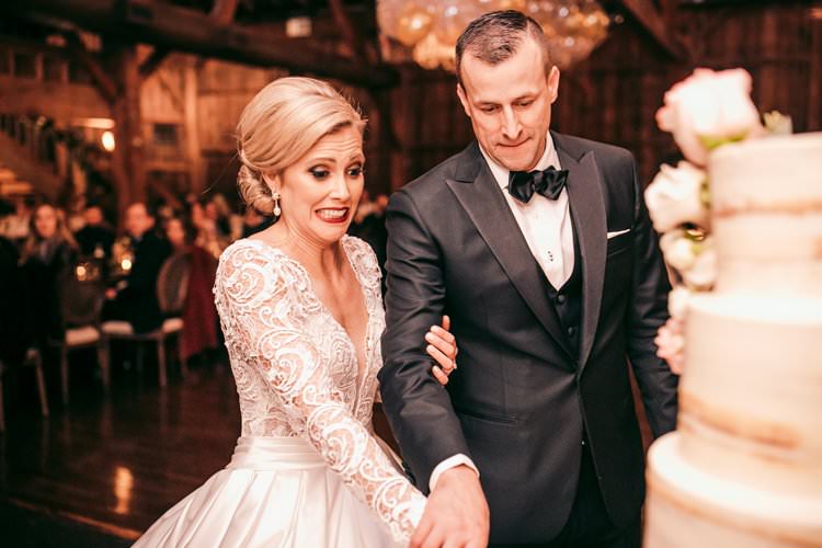 Winter Bride Groom Cutting Cake Long Sleeve Dress Barn | Festive Glamour Christmas New Years Eve Wedding http://www.stevendrayimages.com/