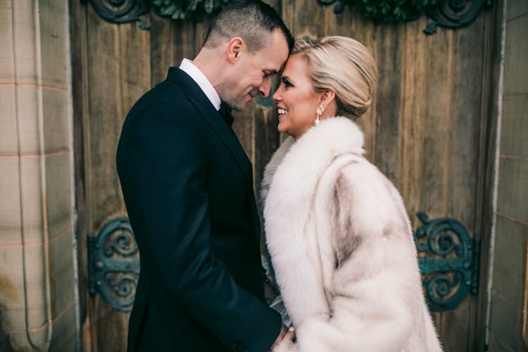 Winter Couple Bride Groom Kiss Fur Coat Barn Navy Suit | Festive Glamour Christmas New Years Eve Wedding http://www.stevendrayimages.com/