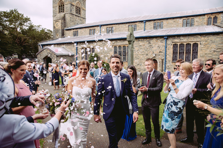 Bride Bridal Enzoani Fishtail Dress Gown Long Veil Navy Suit Confetti Shot Moment Rustic Cosy Autumn Wedding Lake District http://hayleybaxterphotography.com/