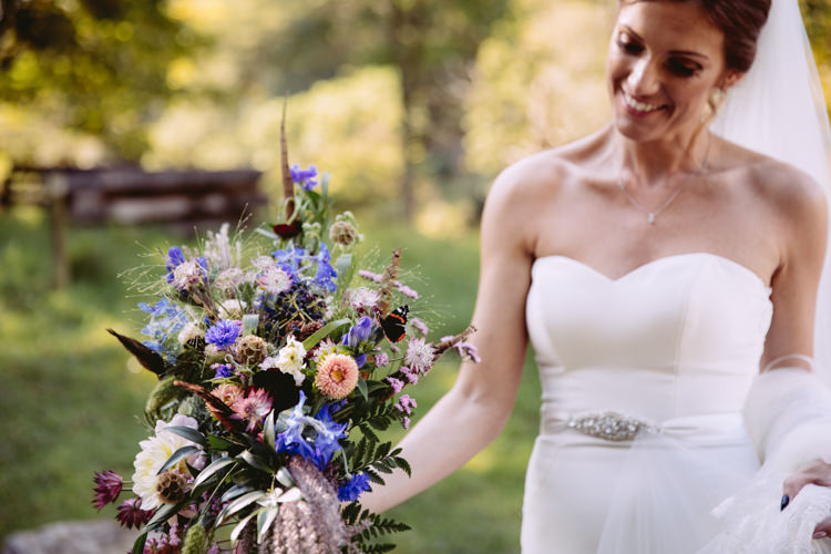 Bride Bridal Sweetheart Neckline Long Veil Bouquet Floral Wild Flower Feather Cornflower Fern Diamante Belt Rustic Cosy Autumn Wedding Lake District http://hayleybaxterphotography.com/