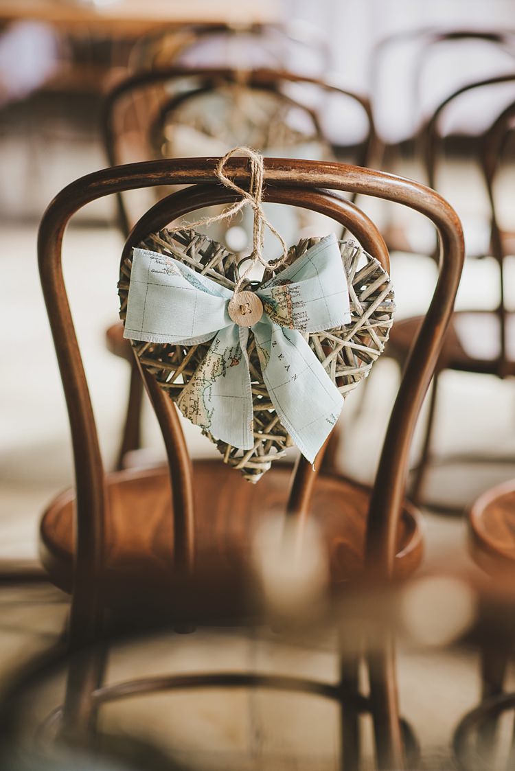 Chair Wicker Heart Ribbon Untraditional Pretty Travel Barn Wedding https://www.georgimabee.com/