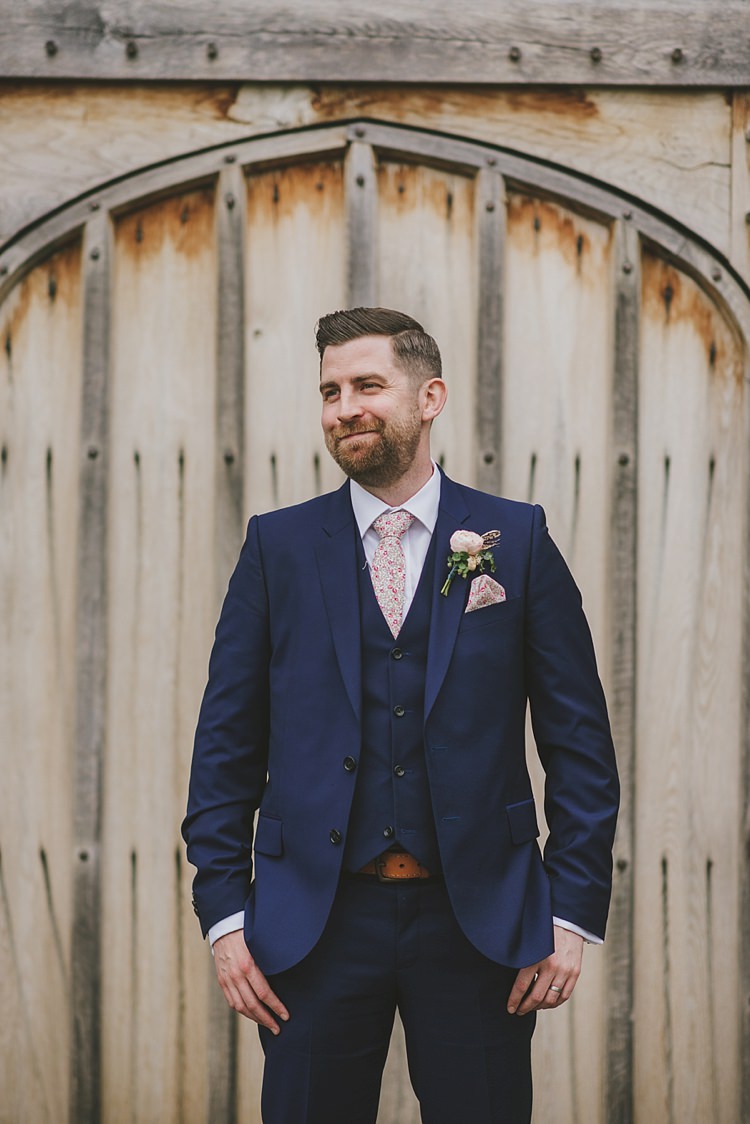 Navy Suit Floral Tie Groom Style Outfit Untraditional Pretty Travel Barn Wedding https://www.georgimabee.com/