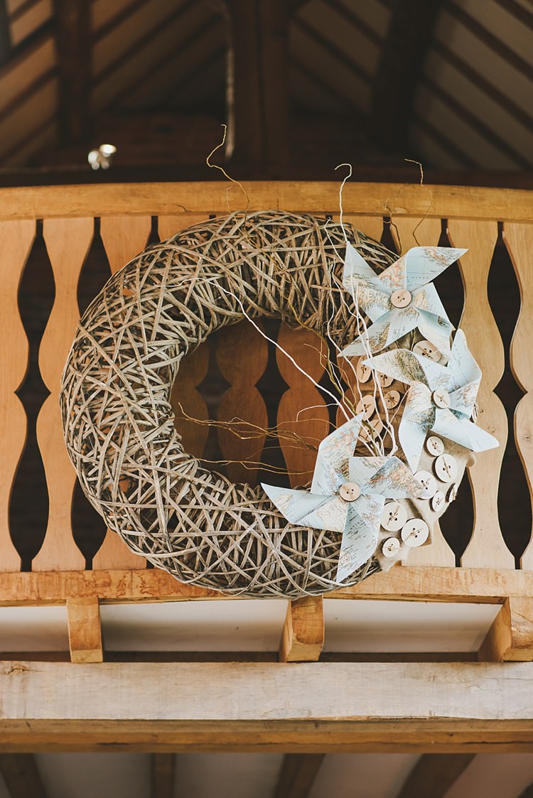 Wicker Wreath Pinwheels Decor Untraditional Pretty Travel Barn Wedding https://www.georgimabee.com/