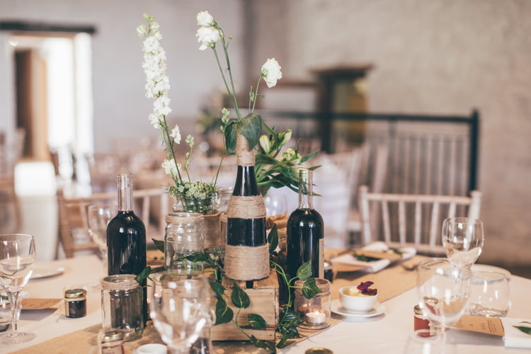 Table Decor Centrepiece Flowers Jars Bottles Hessian Natural Earthy Greenery Home Made Wedding http://rachellambertphotography.co.uk/