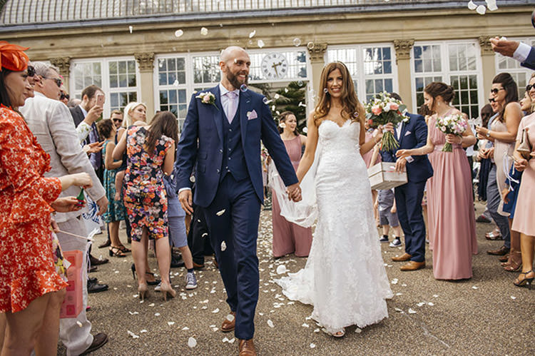 Bride Bridal Gown Dress Essence of Australia Sweetheart Neckline Cathedral Veil Fishtail Three Piece Suit Waistcoat Groom Navy Confetti Shot Moment Pretty Floral Boho Tipi Wedding https://www.kindredphotography.co.uk/
