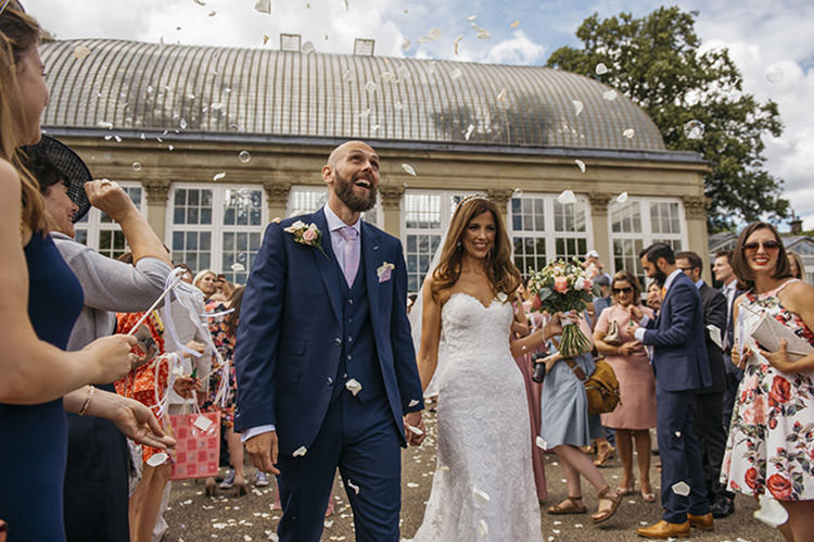Bride Bridal Gown Dress Essence of Australia Sweetheart Neckline Cathedral Veil Fishtail Three Piece Suit Waistcoat Groom Navy Confetti Shot Moment Pretty Floral Boho Tipi Wedding https://www.kindredphotography.co.uk/