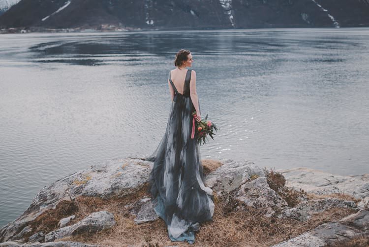 Bride Grey Black Couture Dress Updo Bouquet Norway Mountain Elopement | Moody Chic Norwegian Fjord Wedding Ideas https://www.anoukfotografeert.nl/