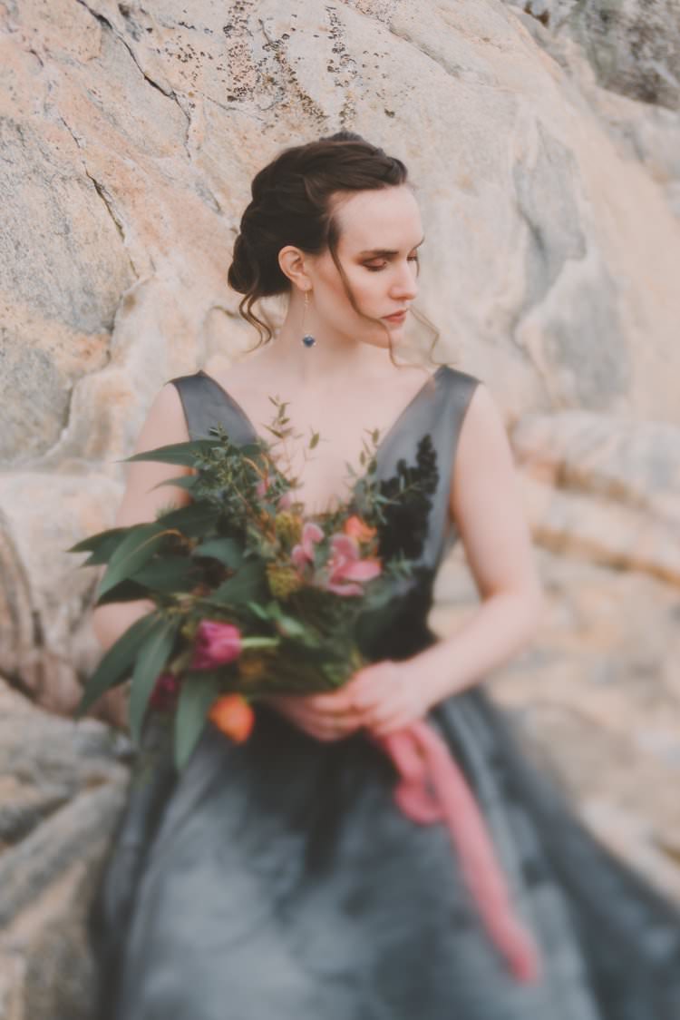 Bride Grey Black Couture Dress Updo Bouquet Norway Mountain Elopement | Moody Chic Norwegian Fjord Wedding Ideas https://www.anoukfotografeert.nl/