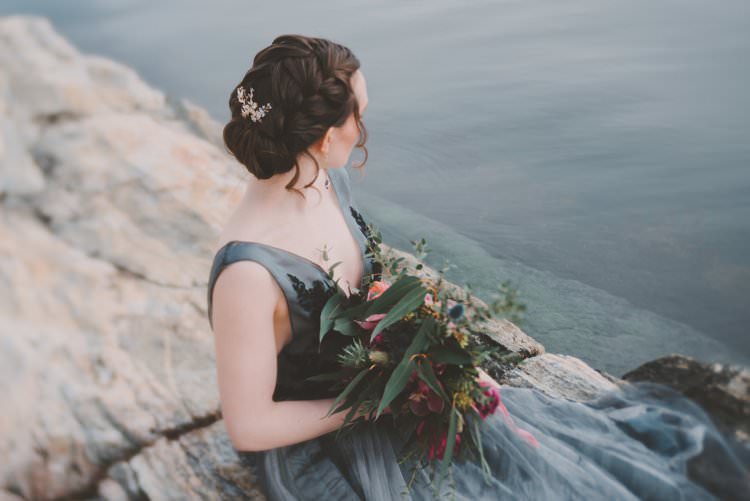 Bride Grey Black Couture Dress Updo Bouquet Norway Mountain Elopement | Moody Chic Norwegian Fjord Wedding Ideas https://www.anoukfotografeert.nl/