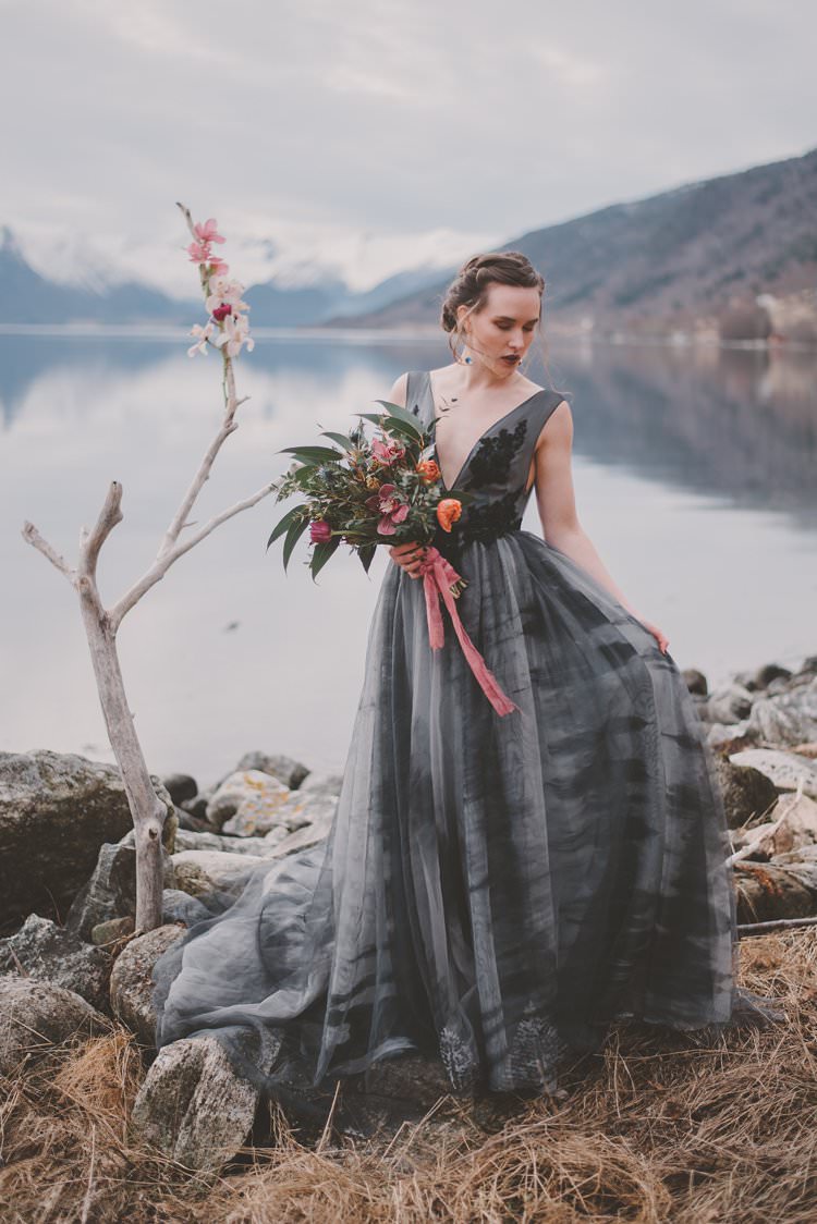 Bride Grey Bouquet Pink Orchid Minimalist Norway Mountain Elopement | Moody Chic Norwegian Fjord Wedding Ideas https://www.anoukfotografeert.nl/