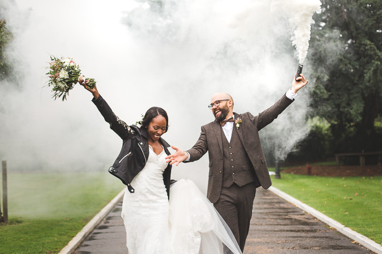 Bride Bridal Maggie Sottero Long Sleeved Lace Dress Sweetheart Leather Jacket Groom Brown Tweed Three Piece Waistcoat Bow Tie Smoke Bomb Whimsical Romantic Barn Wedding http://kirstymackenziephotography.co.uk/