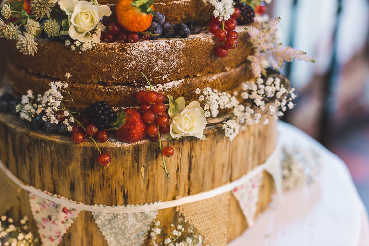 Naked Cake Wood Slice Tree Stand Bunting Fruit Whimsical Romantic Barn Wedding http://kirstymackenziephotography.co.uk/