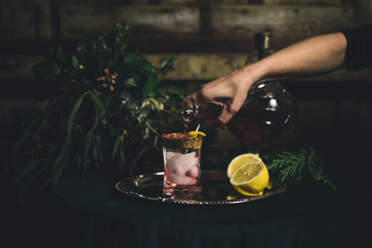 Dark Moody Black Green Decor Gold Glass Drink Decanter | Edgy Emerald City Wedding Ideas http://www.yvonnegollphotography.com/