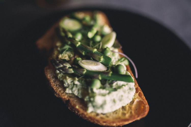 Dark Moody Black Plates Green Food Asparagus Cream Bread | Edgy Emerald City Wedding Ideas http://www.yvonnegollphotography.com/