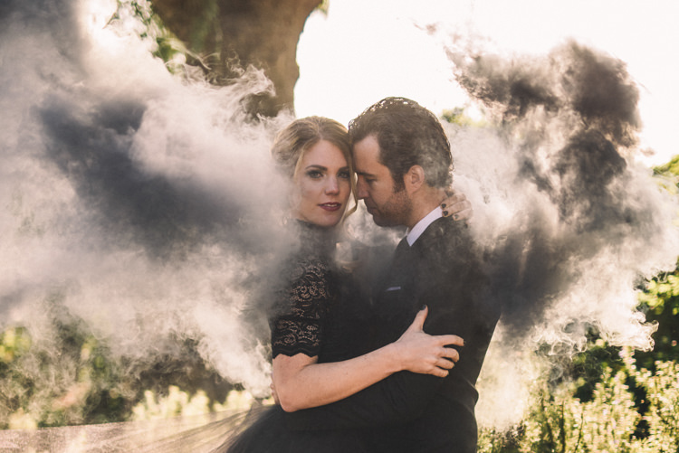 Dark Moody Black Dress Bride Groom Outdoor Smoke Photo | Dark Moody Black Dress Bride Groom Outdoor Smoke Photo | Edgy Emerald City Wedding Ideas http://www.yvonnegollphotography.com/