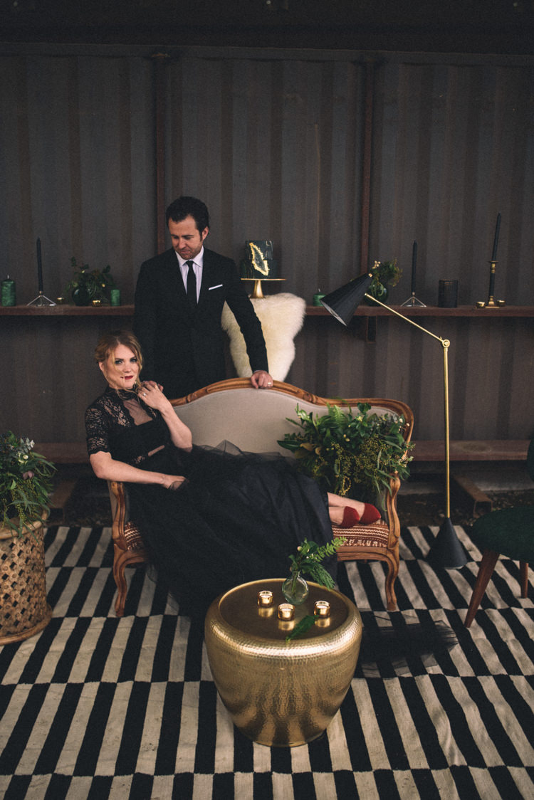 Dark Moody Black Dress Bride Groom Lounge Gold Green Decor | Edgy Emerald City Wedding Ideas http://www.yvonnegollphotography.com/