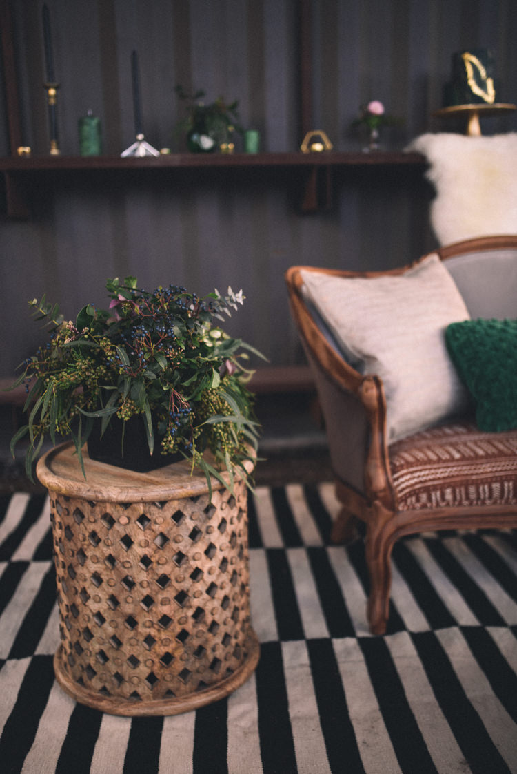 Dark Moody Lounge Gold Green Decor Striped Rug Sofa | Edgy Emerald City Wedding Ideas http://www.yvonnegollphotography.com/