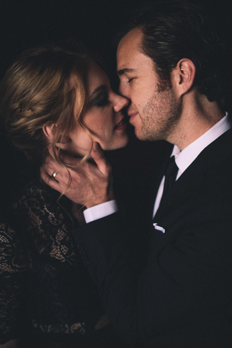 Dark Moody Black Dress Bride Groom Updo Kiss | Edgy Emerald City Wedding Ideas http://www.yvonnegollphotography.com/