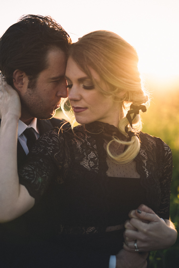 Dark Moody Black Dress Gold Sun Field Outdoor Kiss Bride Braid | Edgy Emerald City Wedding Ideas http://www.yvonnegollphotography.com/