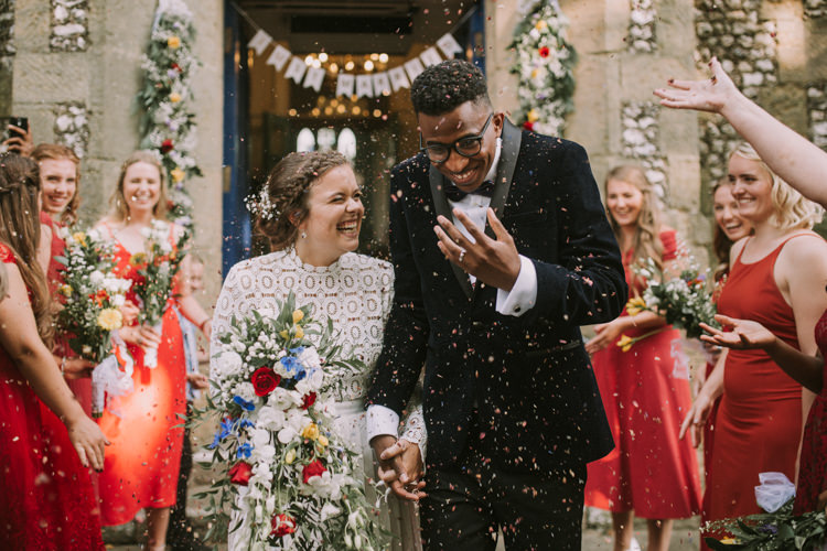 Bride Bridal Self Portrait Wedding Dress Long Sleeved High Neck Multicolour Trailing Bouquet Ribbon Plait Up Do Moss Bros Groom Velvet Tuxedo Jacket Just Married Confetti Garland Just Married Bunting Red Mismatched Bridesmaids Stylish Budget Friendly Village Hall Wedding http://natalyjphotography.com/
